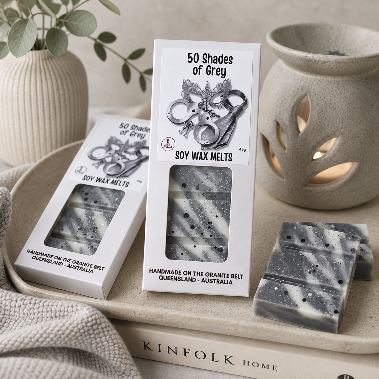 "Lee's Little Luxuries 50 Shades of Grey Soy Wax Melts displayed in an elegant home setting with a ceramic wax burner, marbled grey wax melt cubes and neutral décor, showcasing handmade Australian soy wax melts.