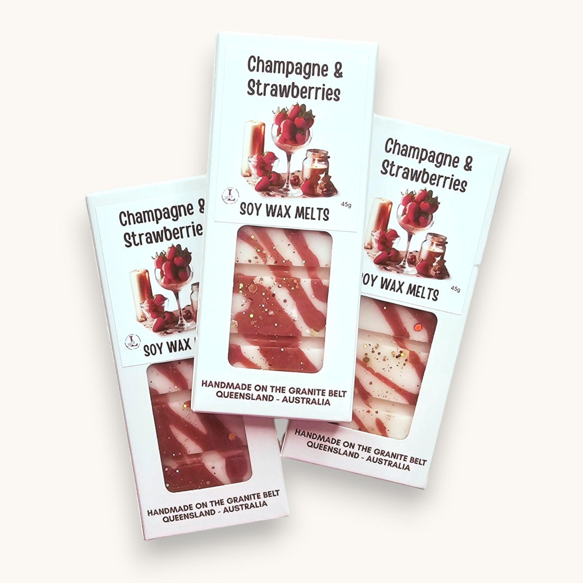 Handmade Champagne & Strawberries Soy Wax Melts in premium hanging packaging with pink and white swirled wax.