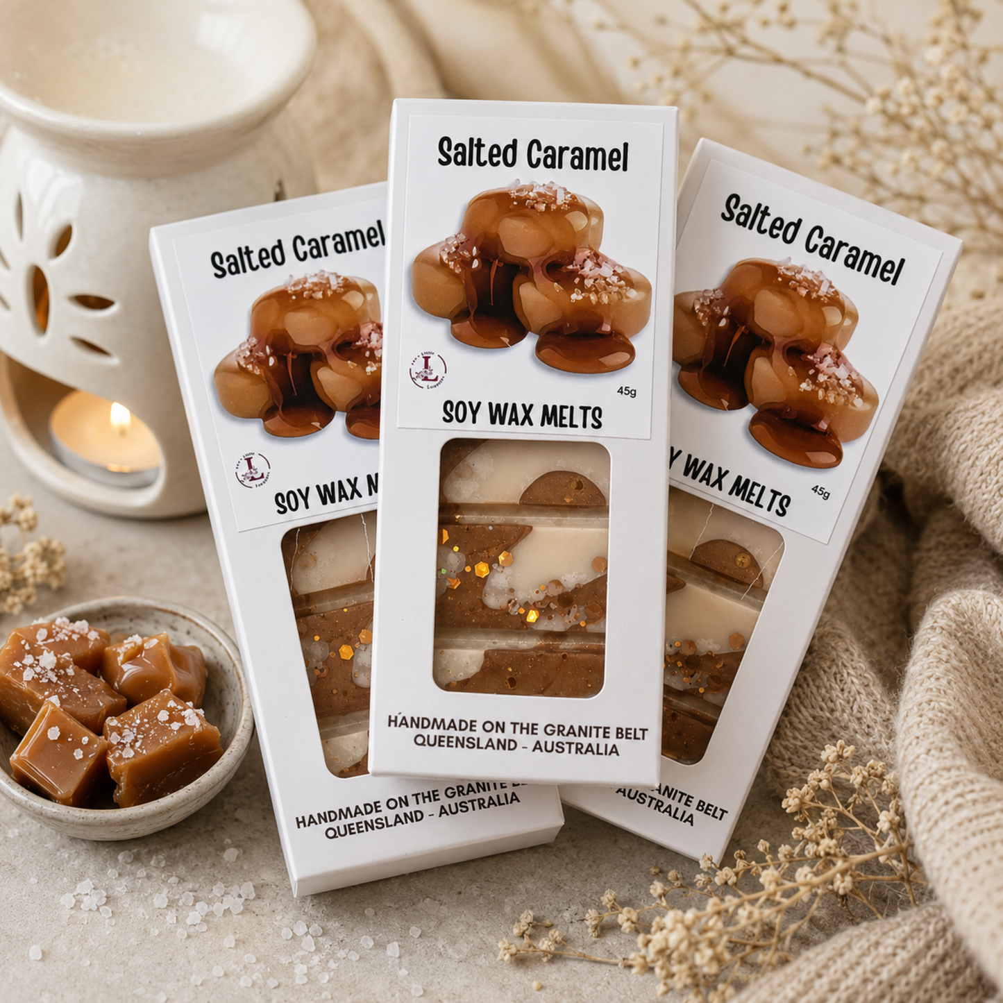 Luxury Salted Caramel Soy Wax Melts by Lee's Little Luxuries displayed with a ceramic wax burner, salted caramel pieces and cosy home décor, handmade on the Granite Belt, Queensland, Australia.